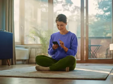 woman-at-home-with-phone-app